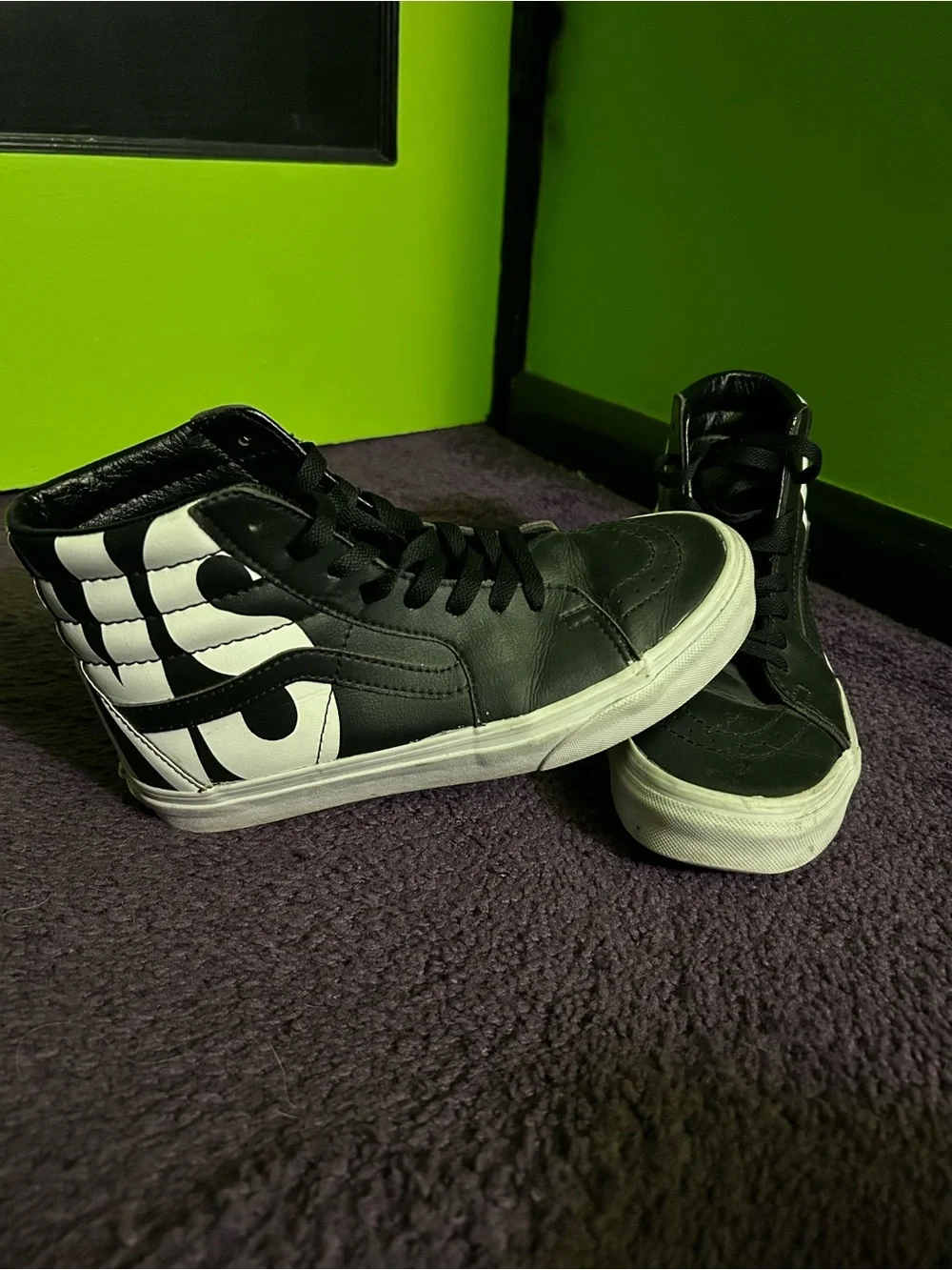 Black and White Vans Leather High Tops
